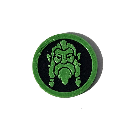 Green and black bearded goblin Halloween token on pure white background