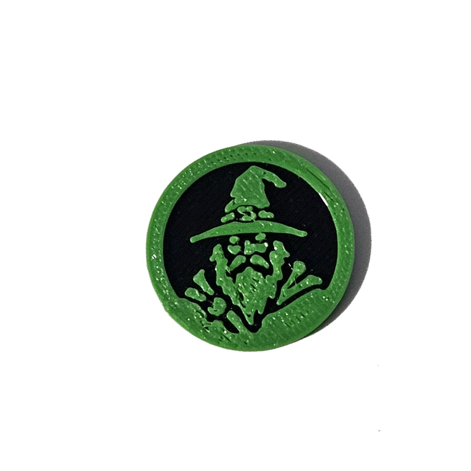 Green and black Halloween character token on pure white background