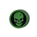 Green and black skull face Halloween token on pure white background
