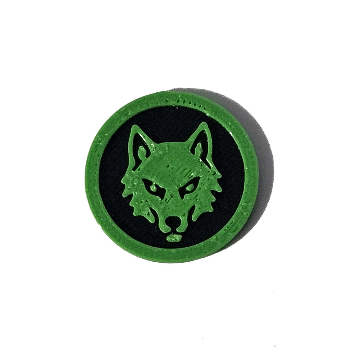 Green and black wolf face Halloween token on pure white background