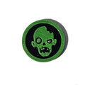 Green and black zombie face Halloween token on pure white background